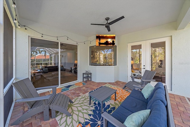 view of patio featuring outdoor lounge area and ceiling fan