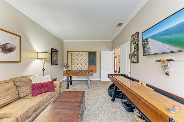 rec room featuring crown molding, light carpet, and a textured ceiling