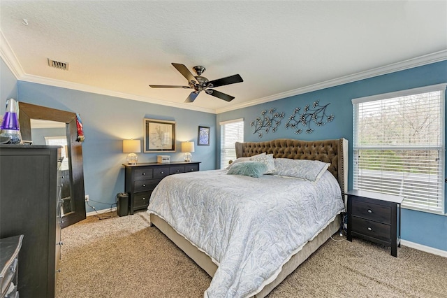 bedroom with crown molding, ceiling fan, light carpet, and a textured ceiling