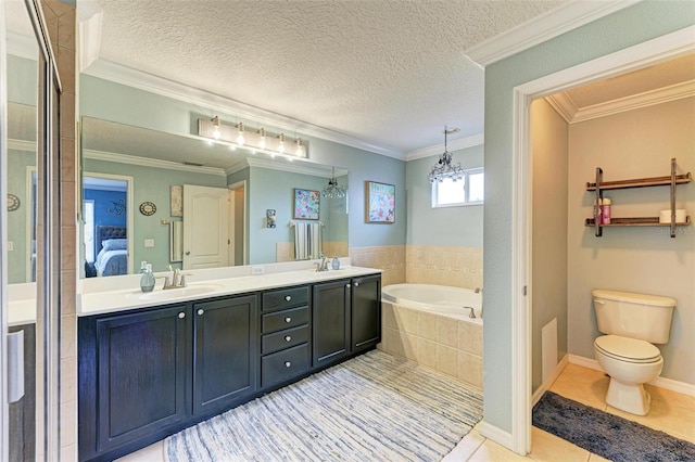 bathroom featuring vanity, tiled tub, tile patterned floors, and ornamental molding