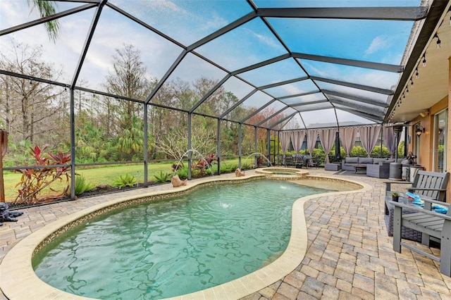 view of pool with outdoor lounge area, an in ground hot tub, pool water feature, glass enclosure, and a patio area