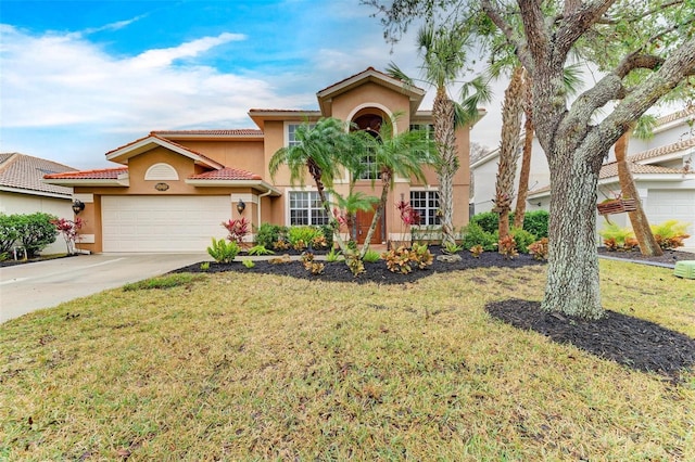 223 Heritage Isles Way, Bradenton, FL 34212 - mediterranean / spanish-style home with concrete driveway, an attached garage, a front lawn, and stucco siding