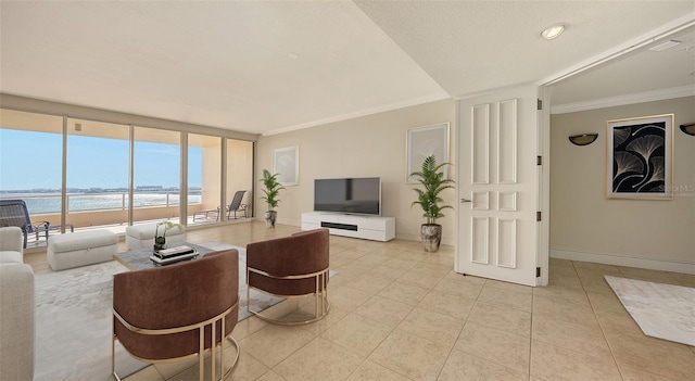 living room featuring ornamental molding, a water view, light tile patterned floors, and a wall of windows