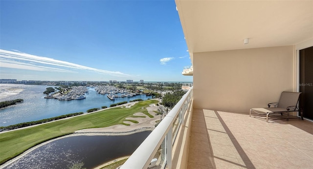 balcony featuring a water view