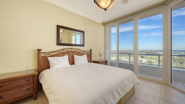 bedroom featuring crown molding, access to outside, and light tile patterned flooring