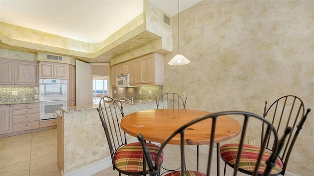 view of tiled dining area