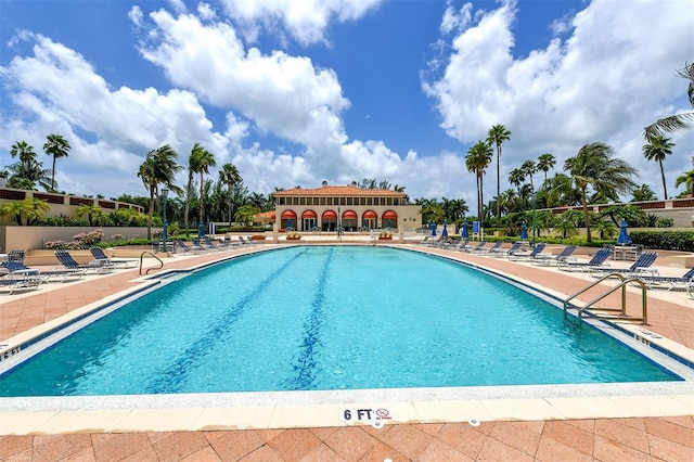 view of swimming pool with a patio area