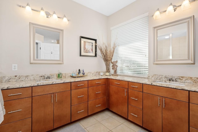 bathroom with vanity and tile patterned flooring