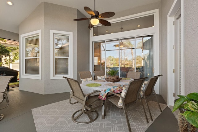 dining room with vaulted ceiling and ceiling fan