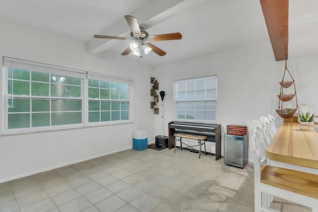 interior space with beamed ceiling and ceiling fan