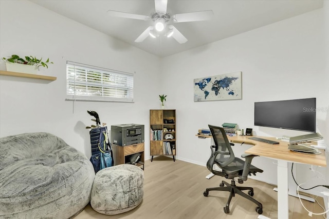 home office featuring ceiling fan and light hardwood / wood-style floors