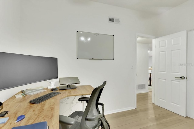 office space with light hardwood / wood-style flooring