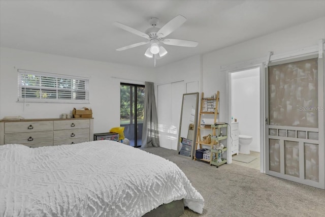 bedroom featuring connected bathroom, ceiling fan, and carpet flooring