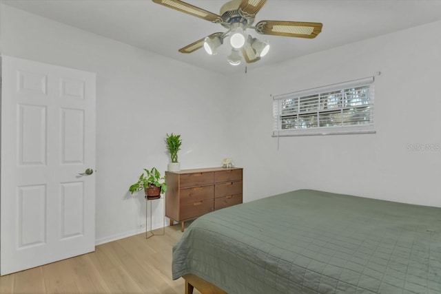 bedroom featuring light wood-type flooring and ceiling fan