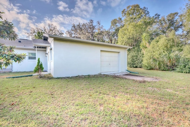 garage featuring a yard