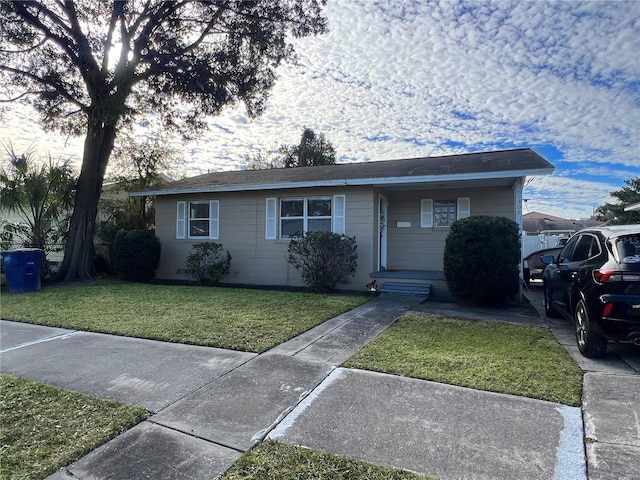 single story home with a front yard