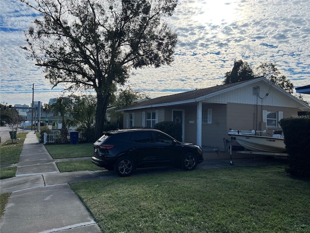 view of property exterior featuring a lawn