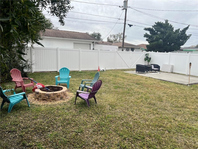 view of yard with a fire pit and a patio area