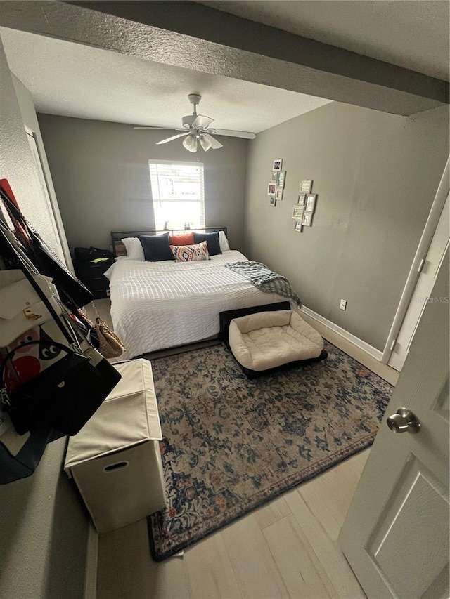 bedroom featuring hardwood / wood-style flooring and ceiling fan