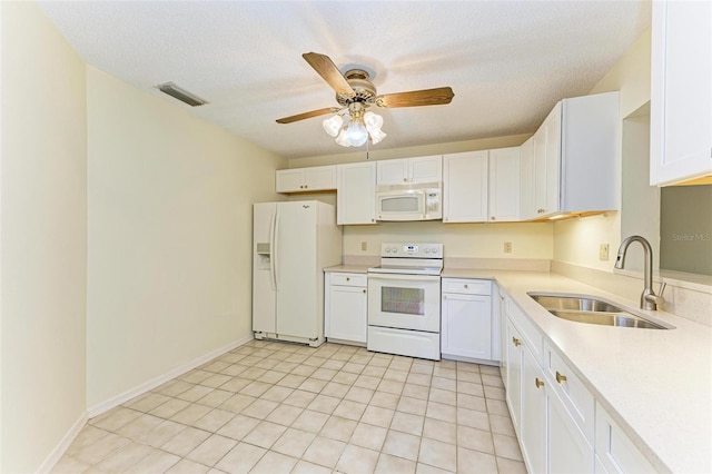 kitchen featuring white cabinetry, sink, white appliances, ceiling fan, and a textured ceiling