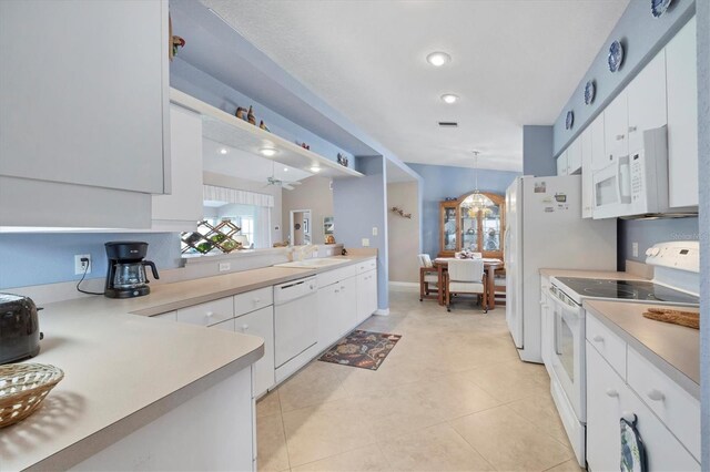 kitchen featuring light tile patterned flooring, sink, white cabinetry, pendant lighting, and white appliances