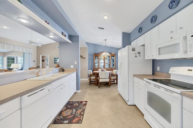 kitchen featuring pendant lighting, sink, white cabinets, ceiling fan, and white appliances