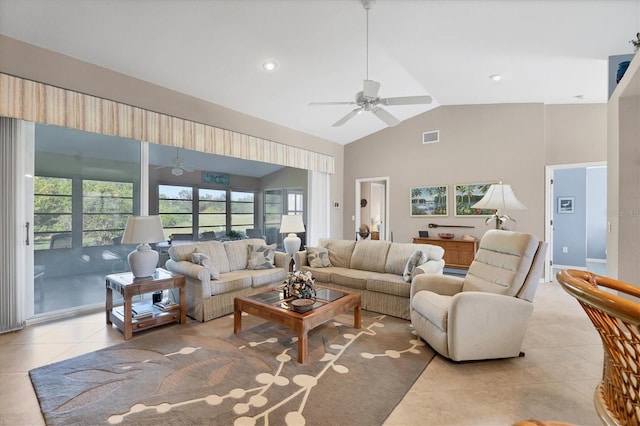 tiled living room featuring ceiling fan, plenty of natural light, and high vaulted ceiling