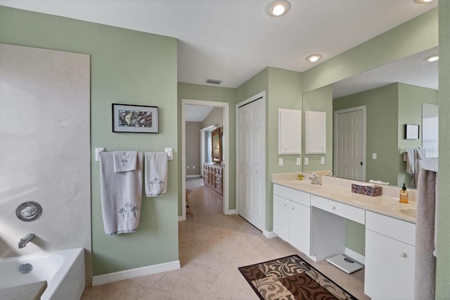 bathroom featuring vanity, tile patterned flooring, and  shower combination