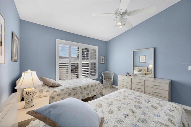 bedroom featuring lofted ceiling, carpet floors, and ceiling fan