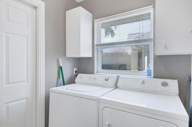 laundry area featuring cabinets and independent washer and dryer