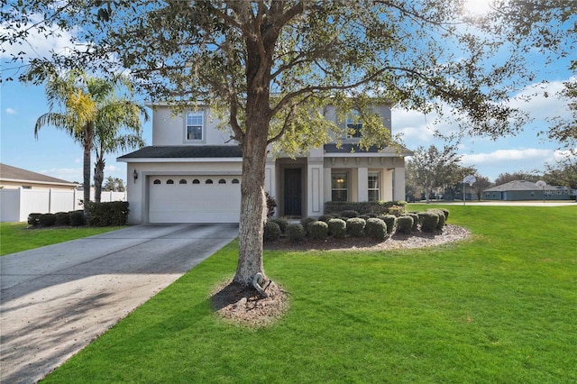 view of front of home with a garage and a front lawn