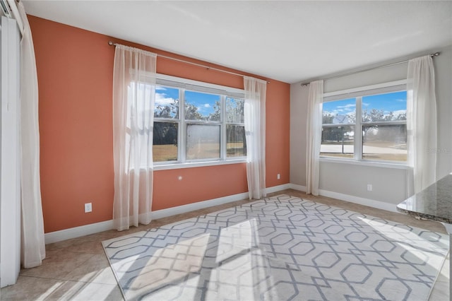 spare room with light tile patterned flooring