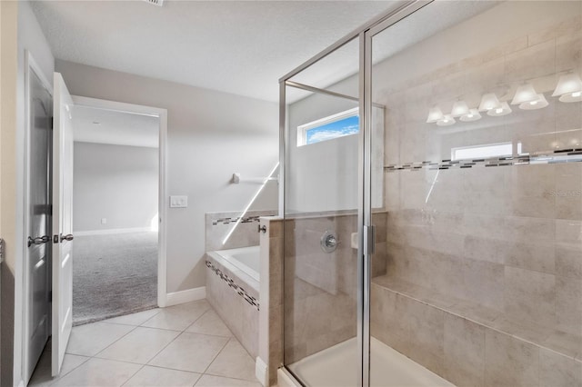 bathroom featuring separate shower and tub and tile patterned flooring