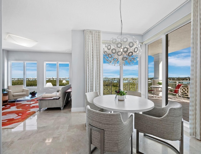 dining space with an inviting chandelier and plenty of natural light