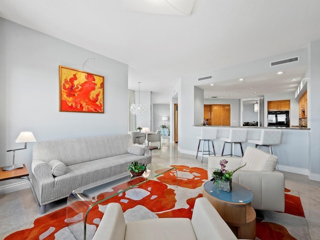 living room with a notable chandelier