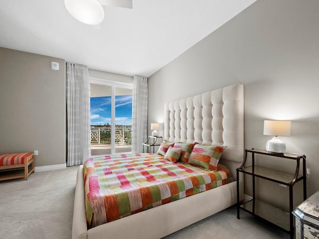 bedroom featuring light colored carpet and access to exterior