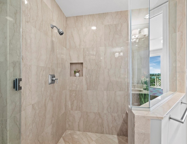 bathroom with a tile shower