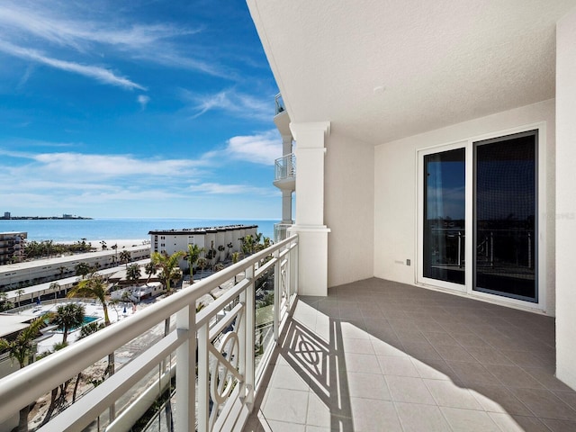 balcony featuring a water view