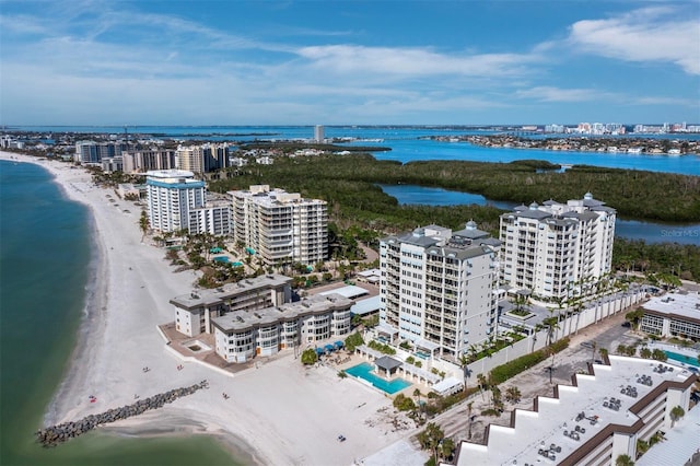 birds eye view of property with a beach view and a water view