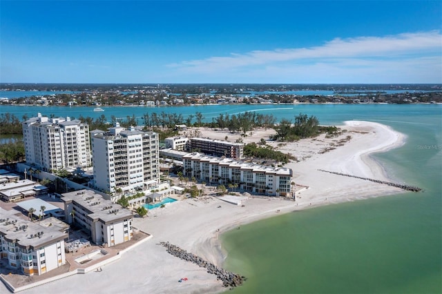 drone / aerial view featuring a view of the beach and a water view