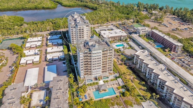 birds eye view of property with a water view