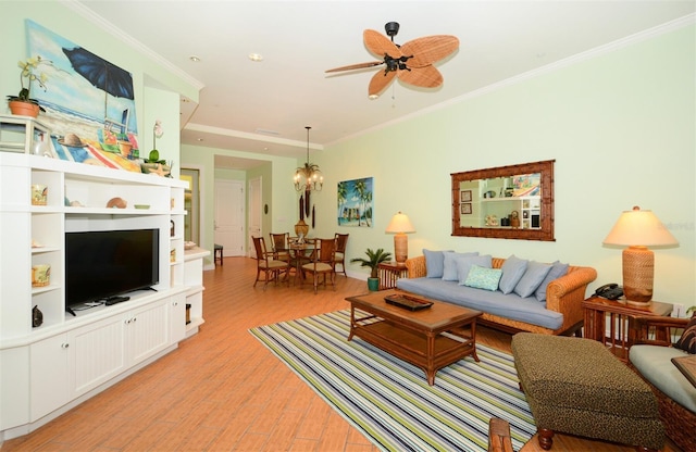 living room with crown molding, ceiling fan with notable chandelier, and light hardwood / wood-style floors