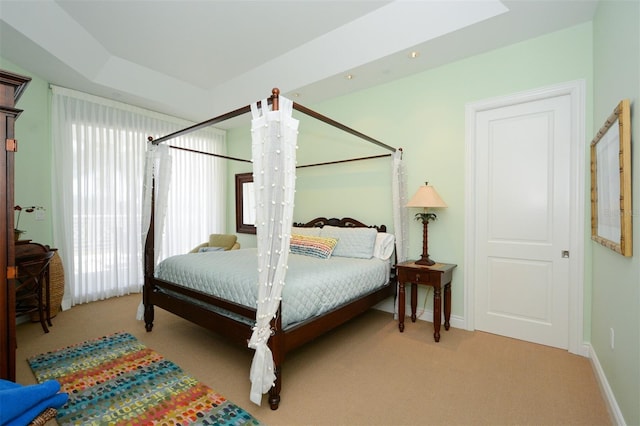 bedroom featuring light colored carpet