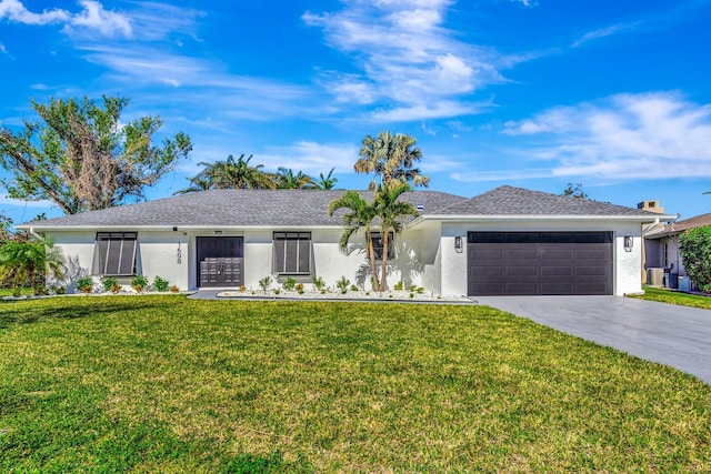 single story home featuring a garage and a front lawn