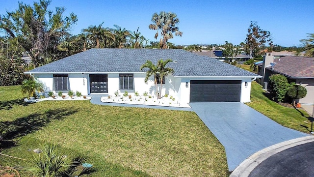 ranch-style house with a garage and a front yard