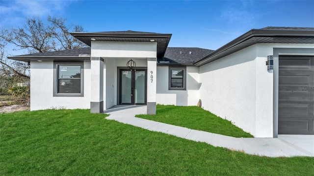 entrance to property with an attached garage, a yard, roof with shingles, and stucco siding