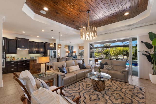 living room with crown molding, light tile patterned floors, wooden ceiling, and a tray ceiling