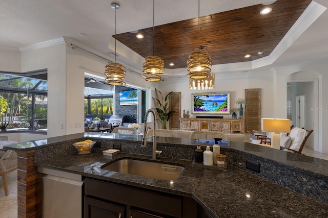 kitchen featuring sink, wooden ceiling, dark stone countertops, a raised ceiling, and pendant lighting