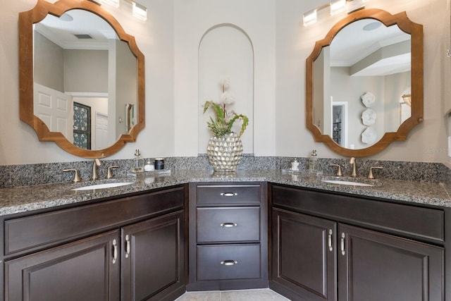 bathroom featuring vanity and crown molding