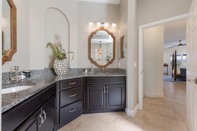 bathroom featuring ceiling fan, vanity, and tile patterned flooring